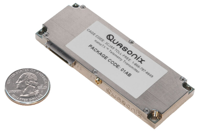 Quasonix nanoTX™ transmitter with quarter for size comparison